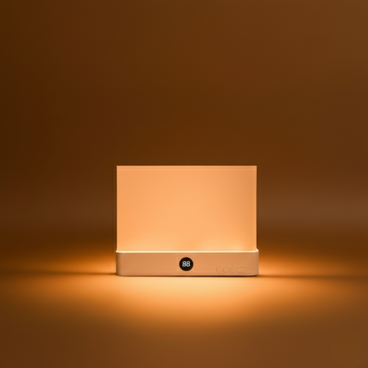 Square light fixture emitting a warm glow on a brown background